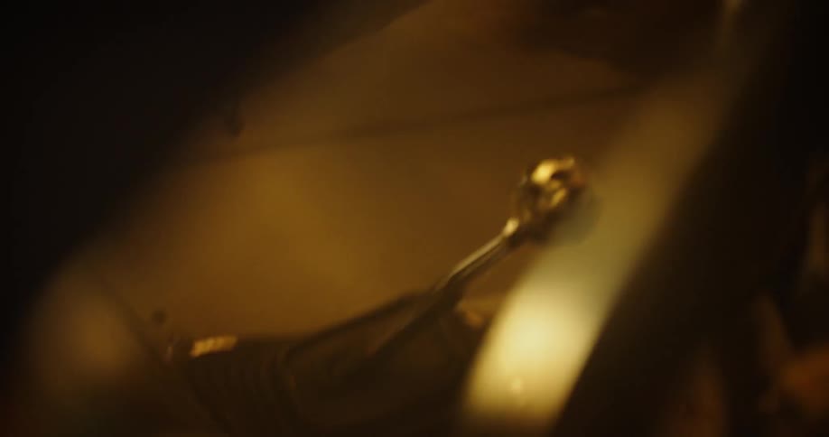 Person shifts a shifter in dim light