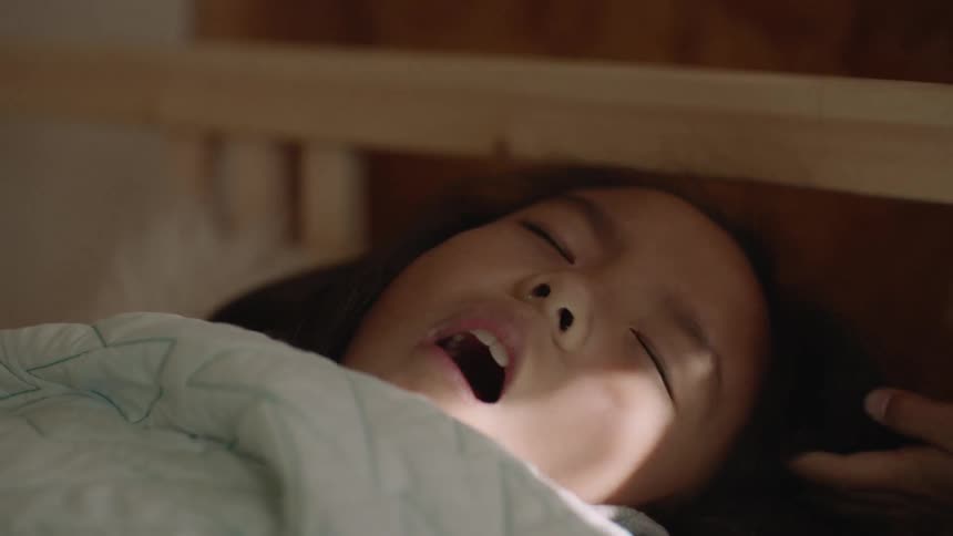A sleeping girl wakes up