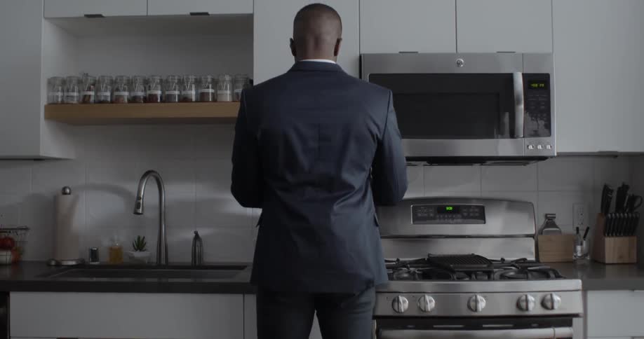 A man brews coffee at home