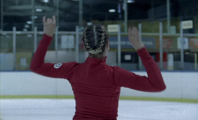 A figure skater spins on the ice
