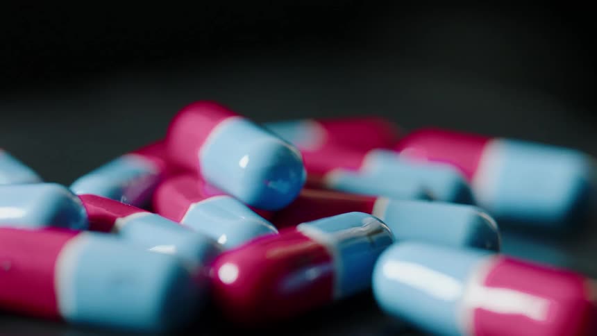 Prescription pills sit on a table