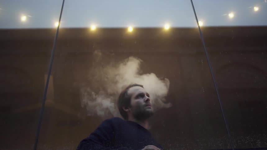 A man standing in smoke