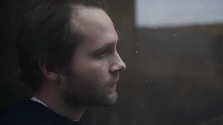 A man is watching intently