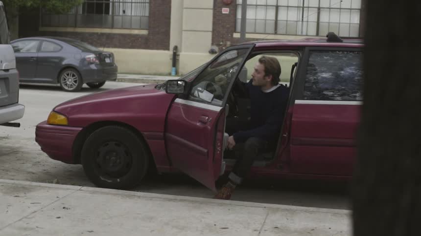 A person sitting in a car