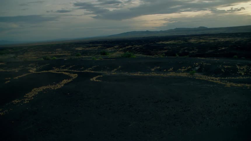 Clouds float above a rural landscape at sunset