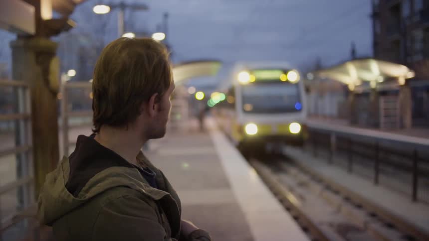 A man is waiting on the train