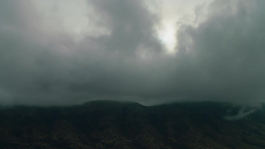 Clouds float above a mountain range