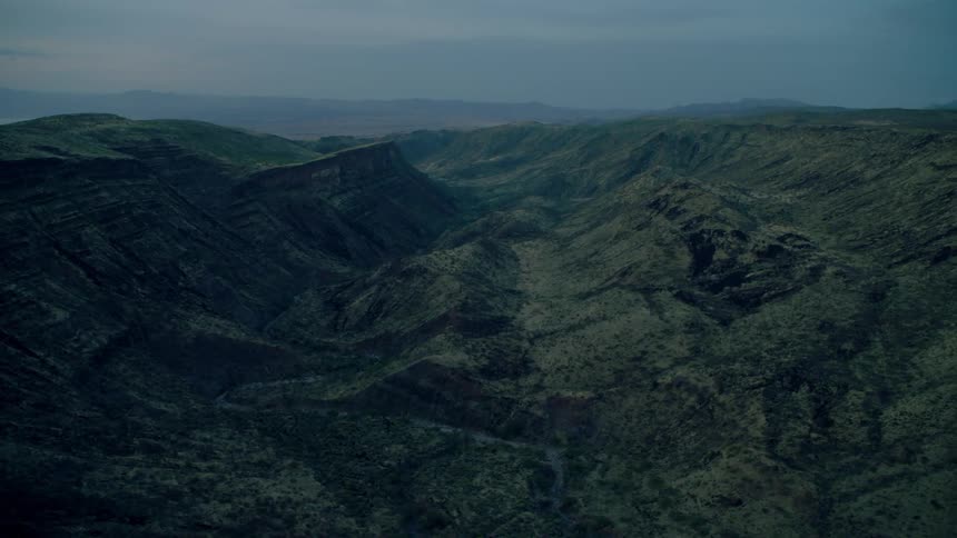 A canyon is between mountains