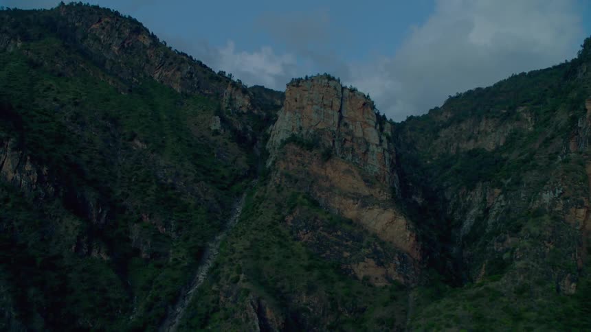 Tall rock formations covered with vegetation