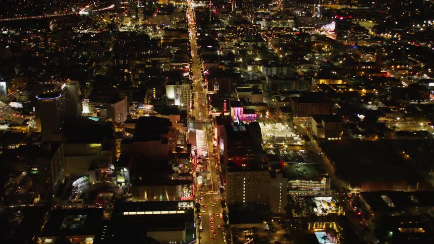 The long strip is heavily lit at night in the city