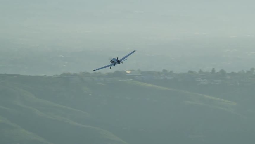The plane turns in the foggy sky