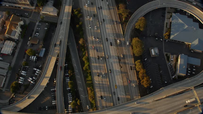 Cars drive on a city highway