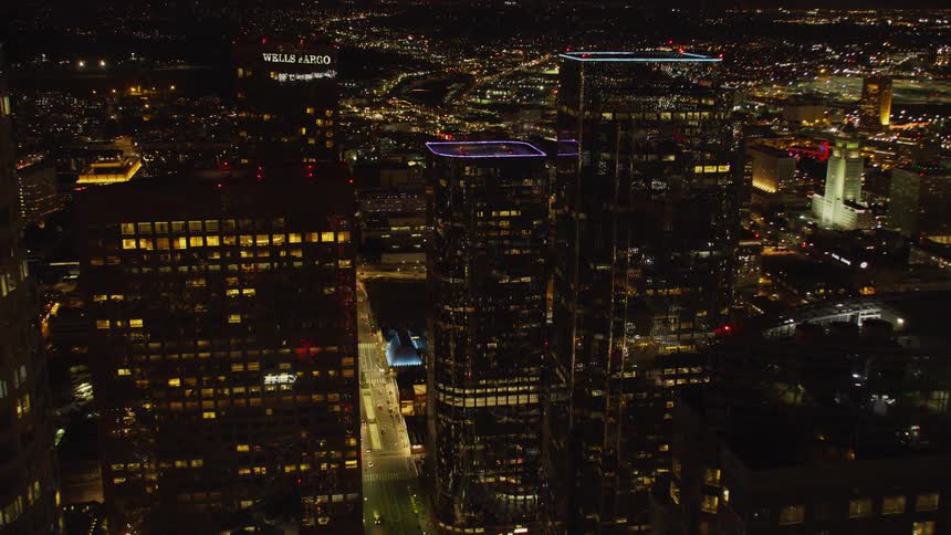 City buildings light up the dark night sky