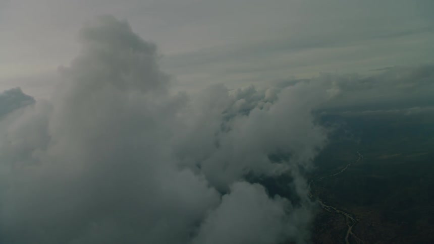 Clouds float above a rural landscape
