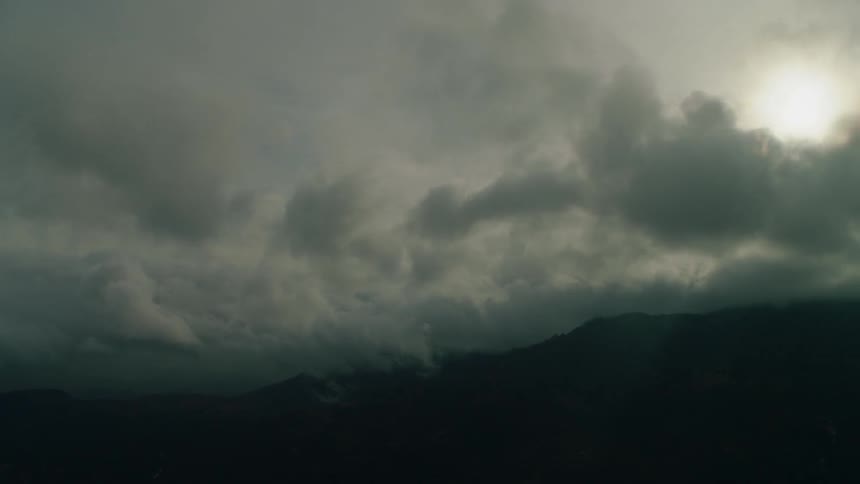 Clouds float over mountains