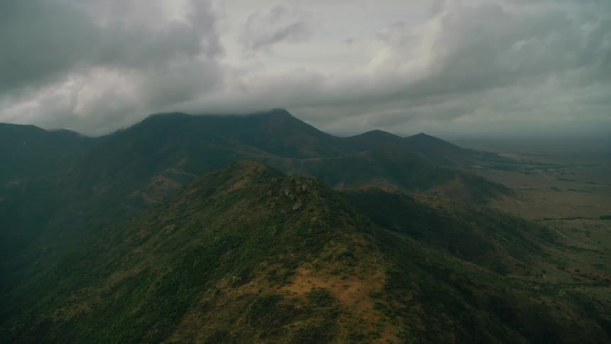 Clouds float over a mountain range