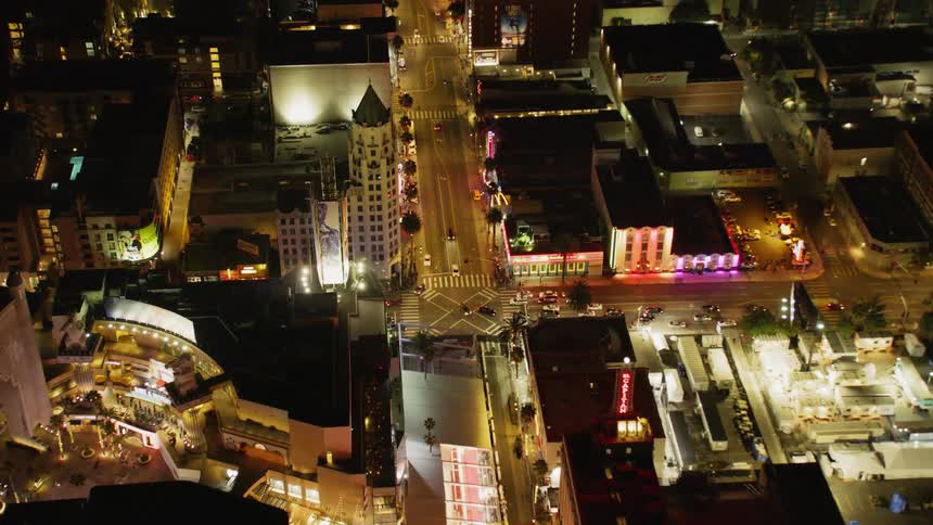 Aerial establishing shot of Hollywood at night