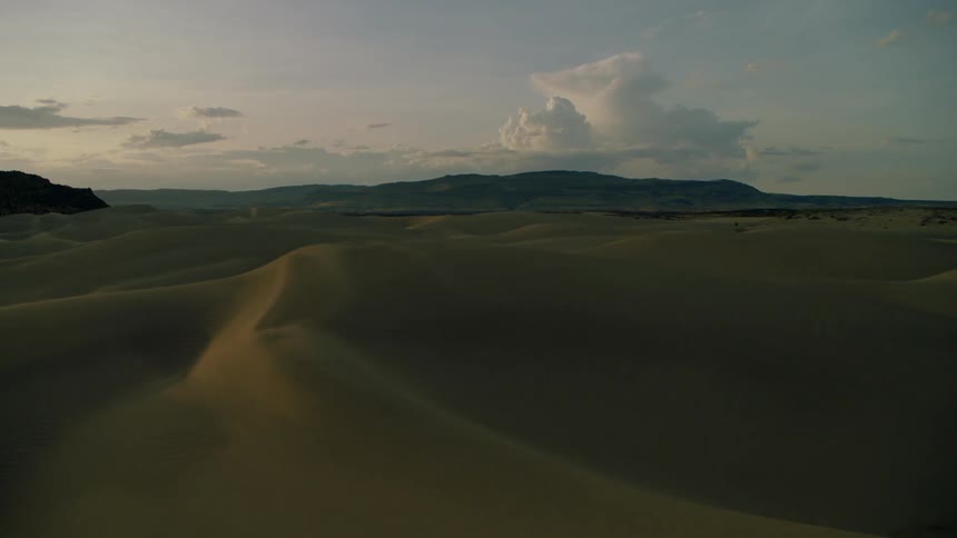 Sand dunes cover the landscape