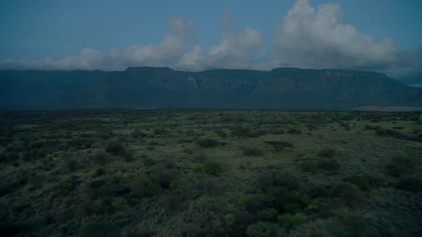 Clouds float above mountains in the wilderness