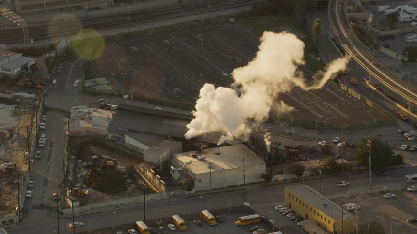 Smoke billows from a factory