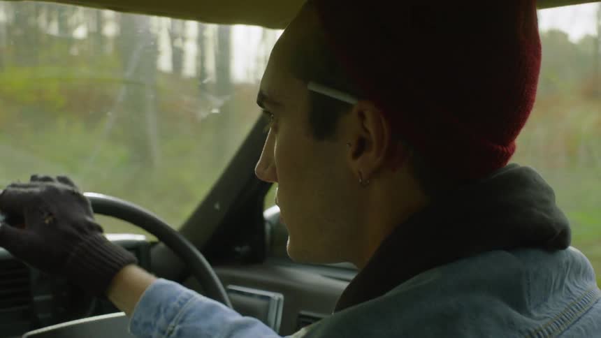 Man drives through a forest