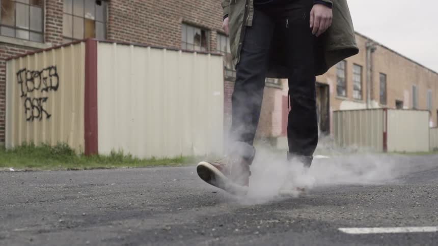 A man is walking through the streets