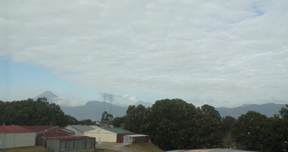 Clouds float above storage buildings