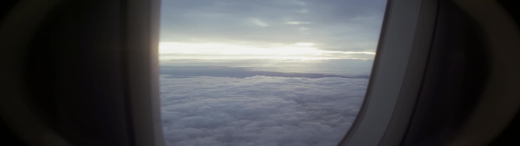 Airplane flies above the clouds
