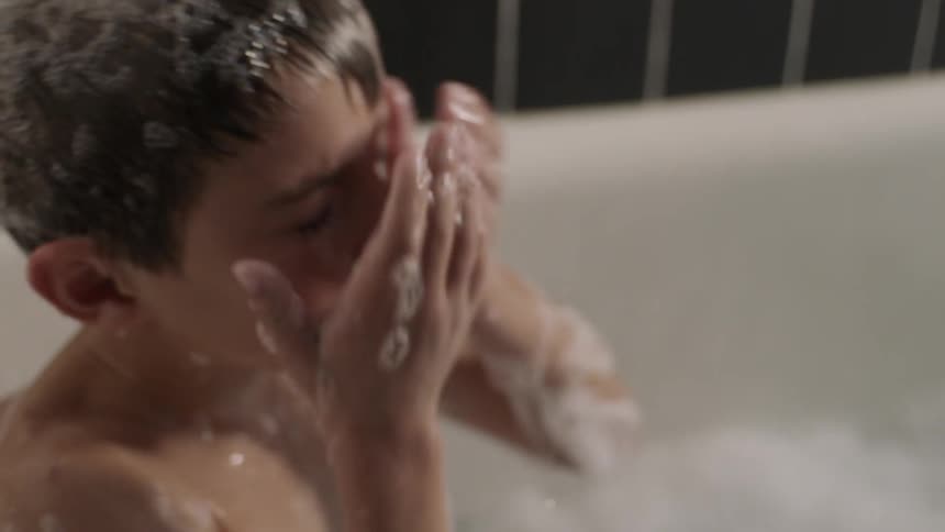 A child is getting a bath
