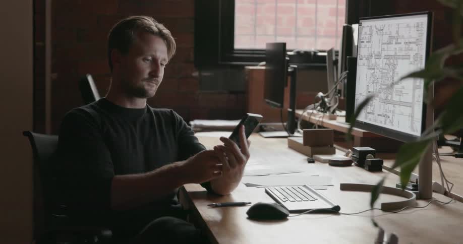 A man works at a computer