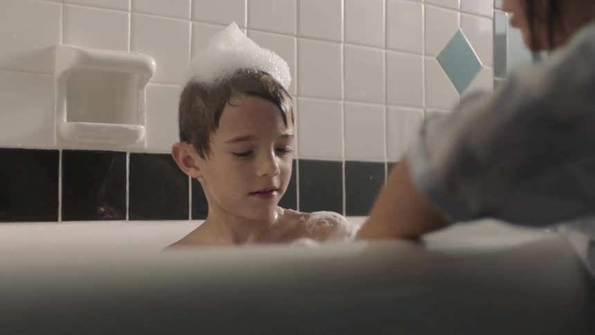 A child is taking a bath