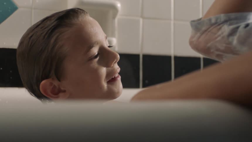 A child plays in a bath