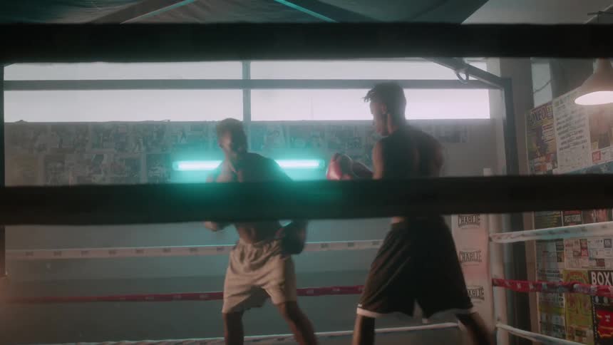 Two men boxing in a boxing ring