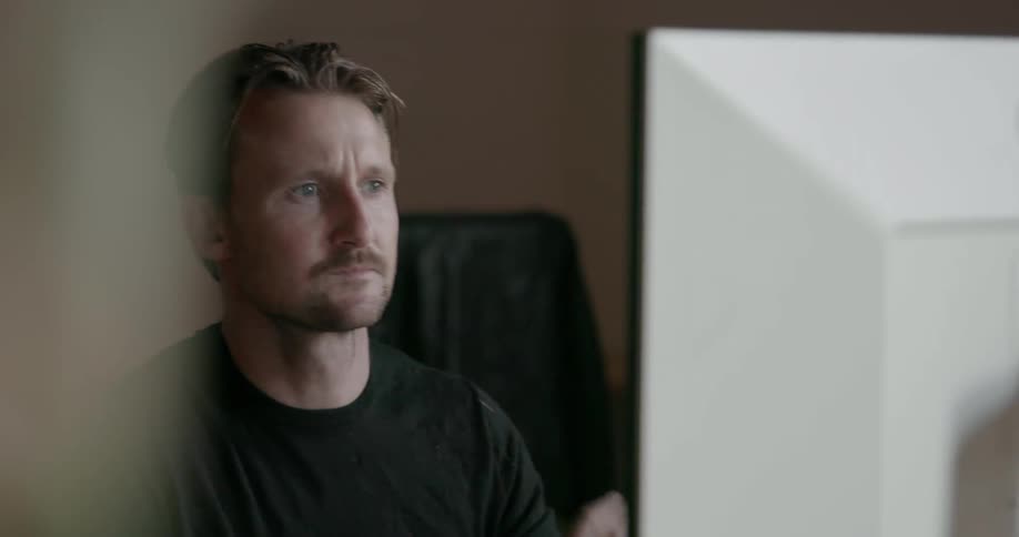 A man works on a computer
