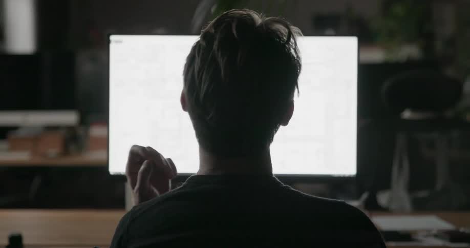 A man works on a computer