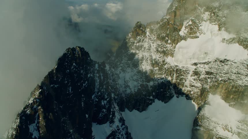 Flying over a snow covered mountain