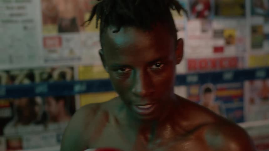 A boxer punches the air