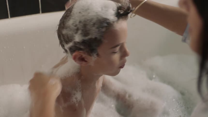 A child is getting a bath