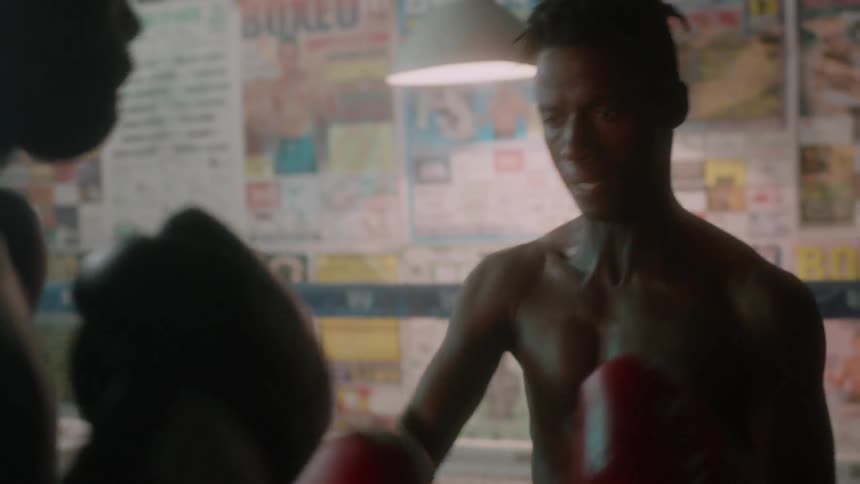 Two men box in a boxing ring