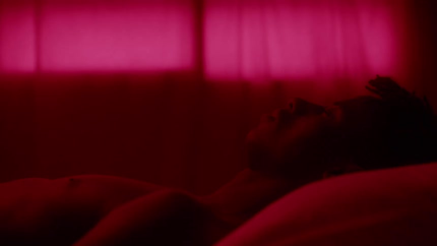 A man is sleeping in the bed