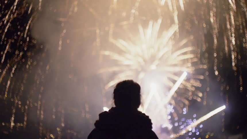 Fireworks explode in the night sky