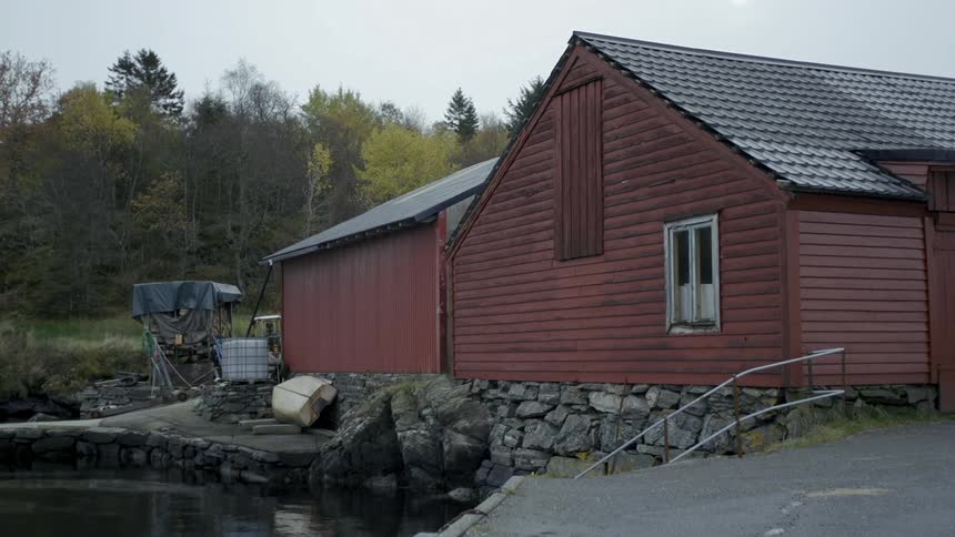 A building sits on a lakeshore