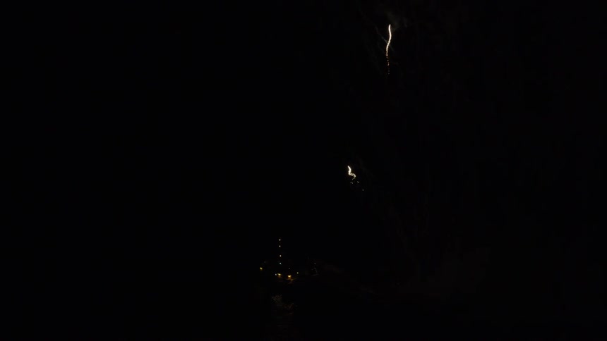 Fireworks shoot into the night sky
