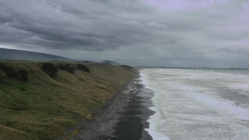 Ocean waves wash ashore a beach