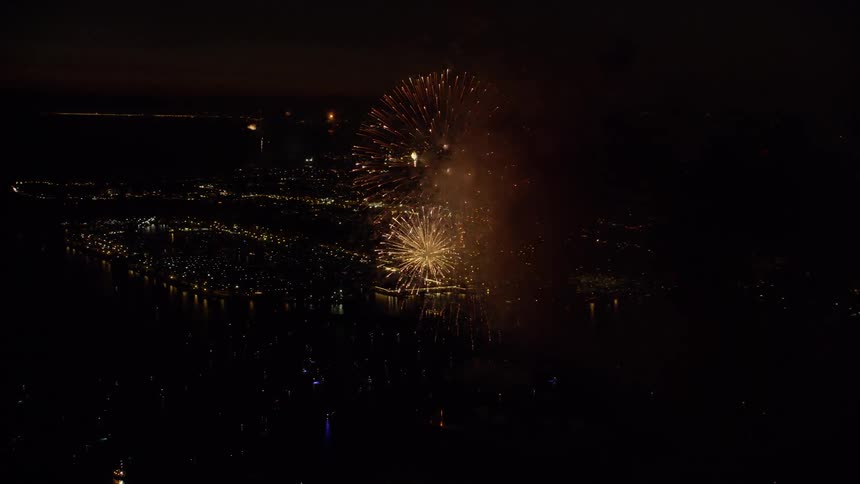 Multiple fireworks displays can be seen from the sky