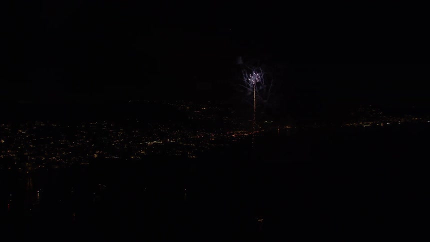Aerial footage of New Years Eve (NYE) Fireworks display above the ocean