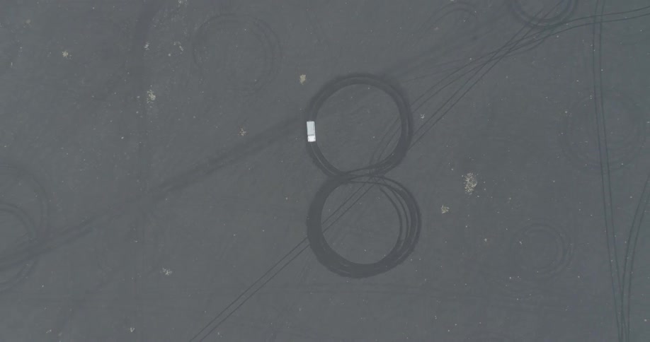 Vehicle travels over a figure eight design in a field