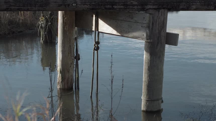 Water flows around a dock