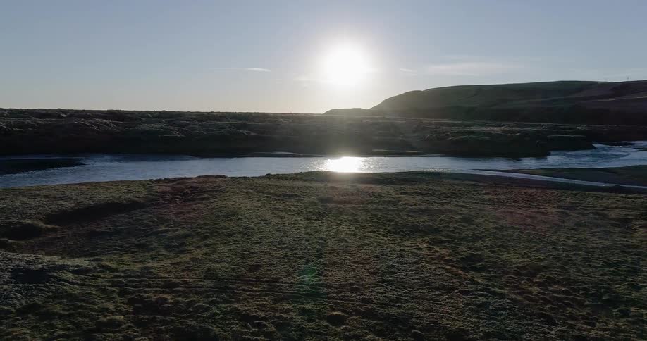 The sun shines on a stream