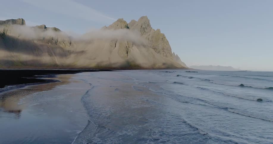 Ocean waves wash ashore a beach